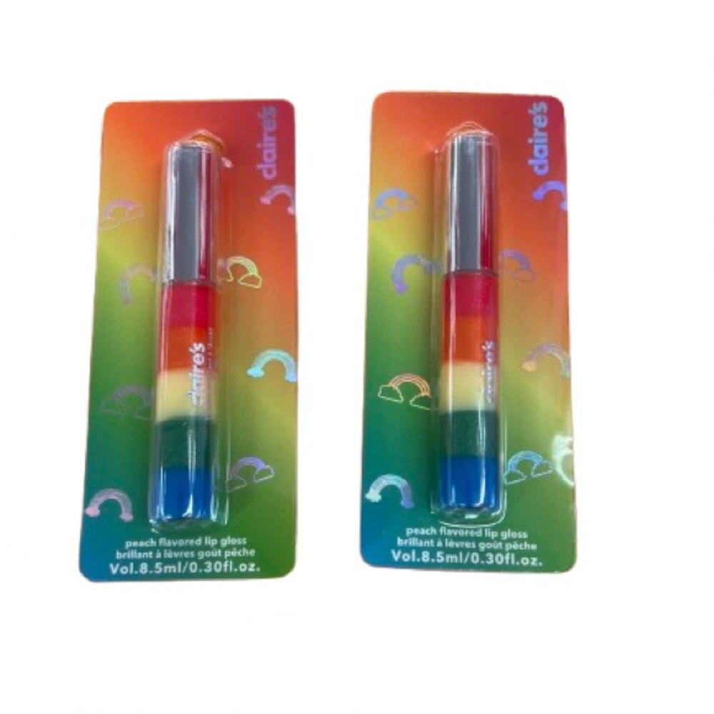 #496 Claire’s  2  peach flavored lip glosses